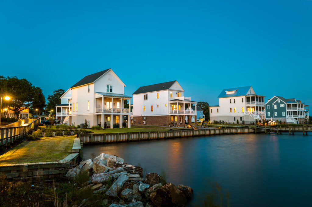 Waterfront homes with evening lights
