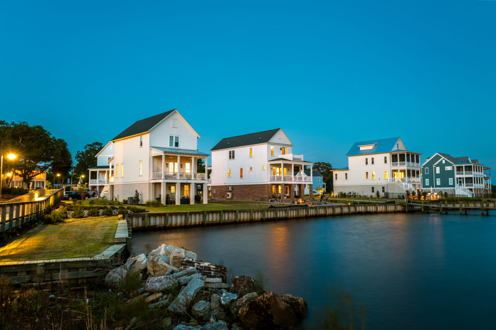 Waterfront homes with evening lights