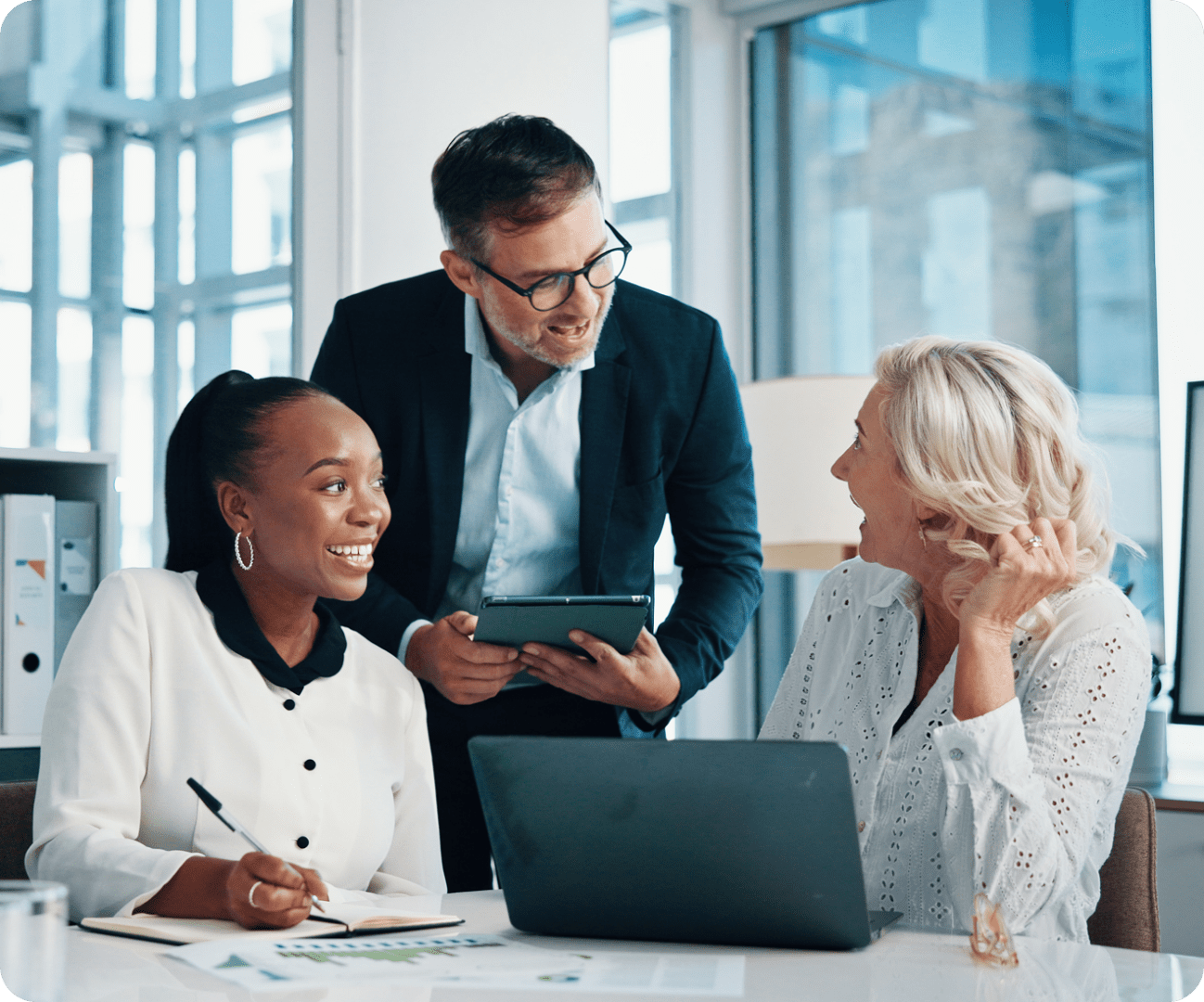 Colleagues discussing work in an office