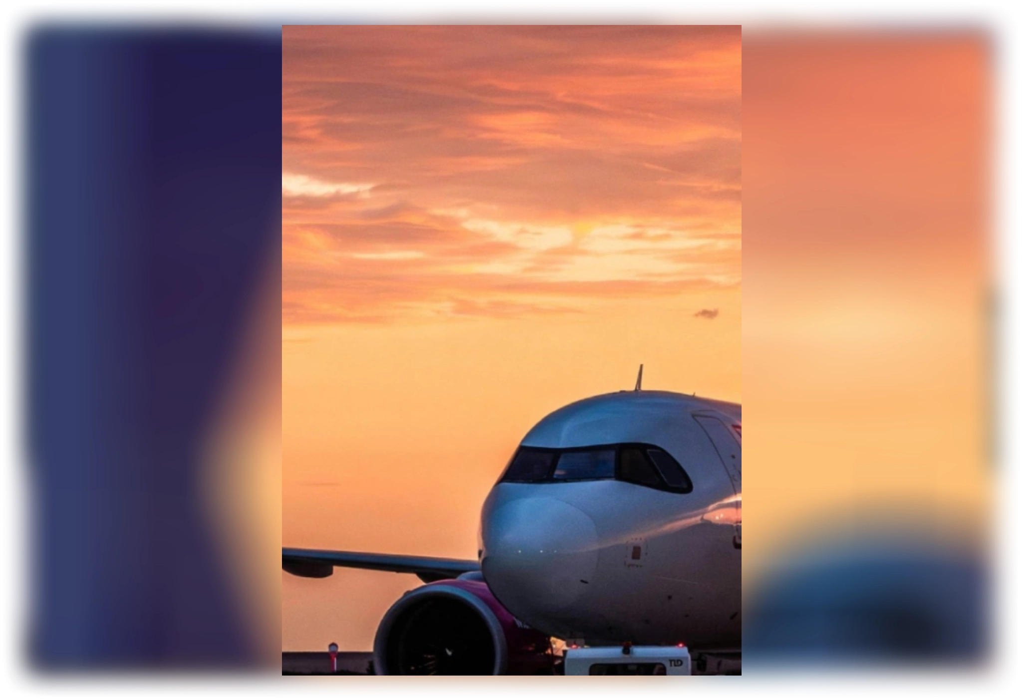 Airplane nose at sunset on runway
